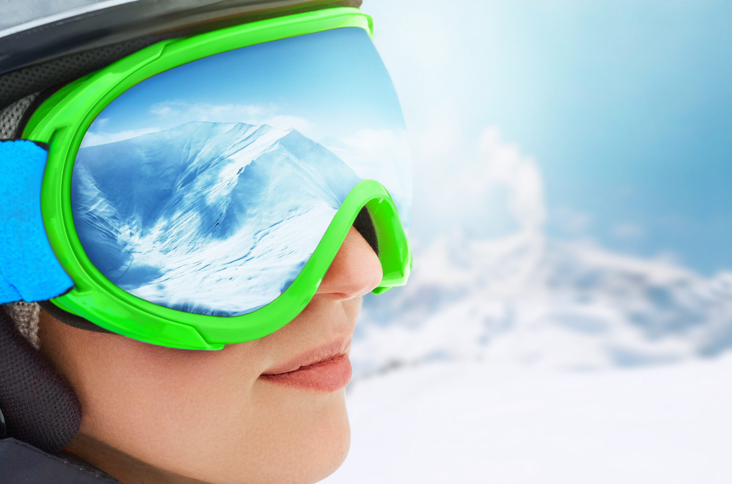 Is it better for ski goggles to have high or low light transmittance?